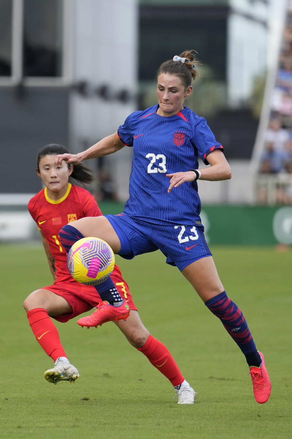 United States defender Emily Fox controls the ball ahead of China forward Yan Jinjin during the first half of a women's International friendly soccer match in Fort Lauderdale, Fla., Saturday, Dec. 2, 2023. (AP Photo/Rebecca Blackwell)