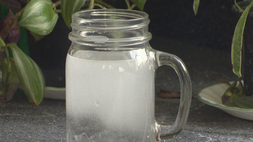 Natalie Lent's tap water was still cloudy and smelly, despite having a reverse-osmosis system hooked up in her kitchen. The system was recently removed and she received her money back.