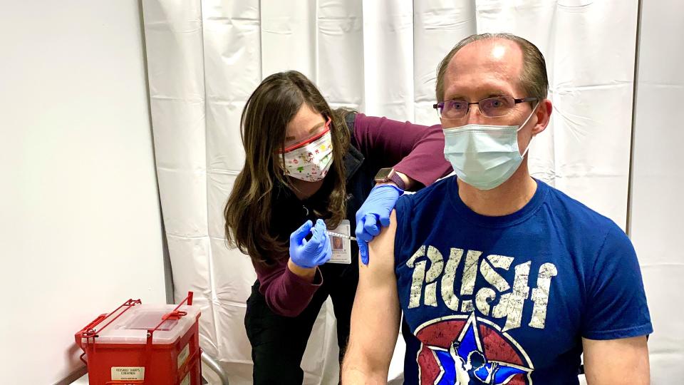 Brian Weis, the chief medical officer at the Northwest Texas Healthcare System, receives the first dose of the two dose Pfizer COVID-19 vaccine in this file photo.