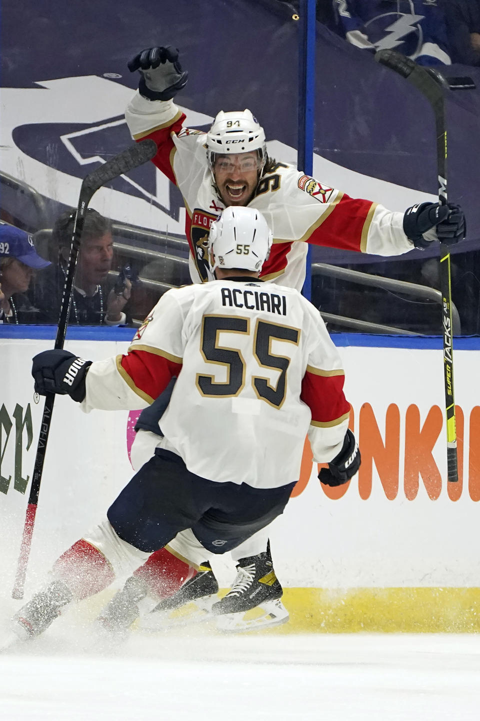 FILE - Florida Panthers left wing Ryan Lomberg (94) celebrates his goal against the Tampa Bay Lightning with center Noel Acciari (55) during overtime in Game 3 of an NHL hockey Stanley Cup first-round playoff series in Tampa, Fla., in this Thursday, May 20, 2021, file photo. A pandemic postseason outside a bubble has led to some thrilling hockey after an exhausting, condensed 56-game grind. (AP Photo/Chris O'Meara, File)