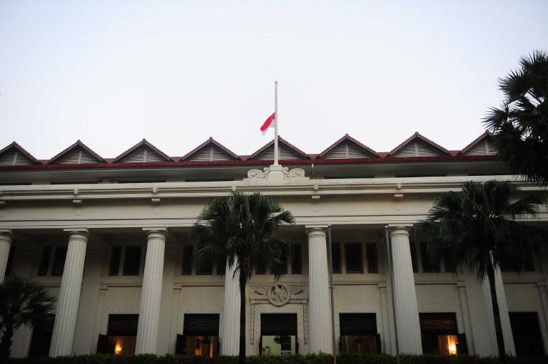 A Singapore flag flies at half mast at Singapore General Hospital following Lee Kuan Yew's death