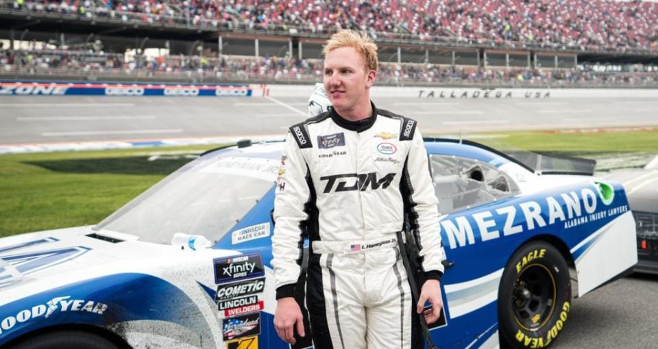 Leland Honeyman Jr. stands next to his car after the NASCAR Xfinity Series race at Talladega.