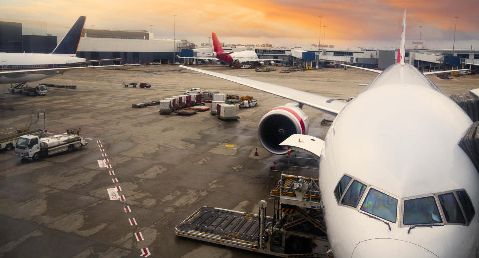 View of airplane at the airport at sunrise. Source: Getty Images 