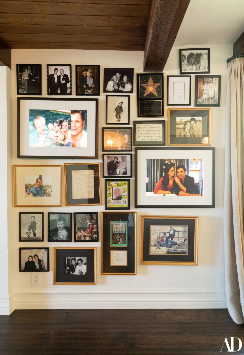 The dining room features a spread of pictures and other personal items, including framed letters from Stamos’s late parents and notes from celebrities and friends. Stamos shares: “Grease is one of my favorite movies, and I had John Travolta sign a picture after I told him he was my inspiration for becoming an actor. So he wrote, ‘I’m proud to be your inspiration.’”