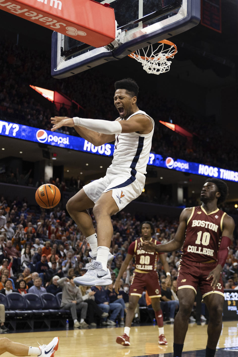 Virginia's Jayden Gardner reacts after a basket against Boston College during the second half of an NCAA college basketball game in Charlottesville, Va., Saturday, Jan. 28, 2023. (AP Photo/Mike Kropf)