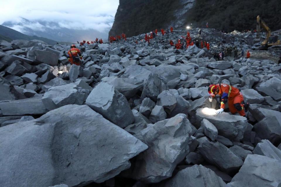 Rescue: 120 people are still missing and are believed to have been buried in the landslide (REUTERS)