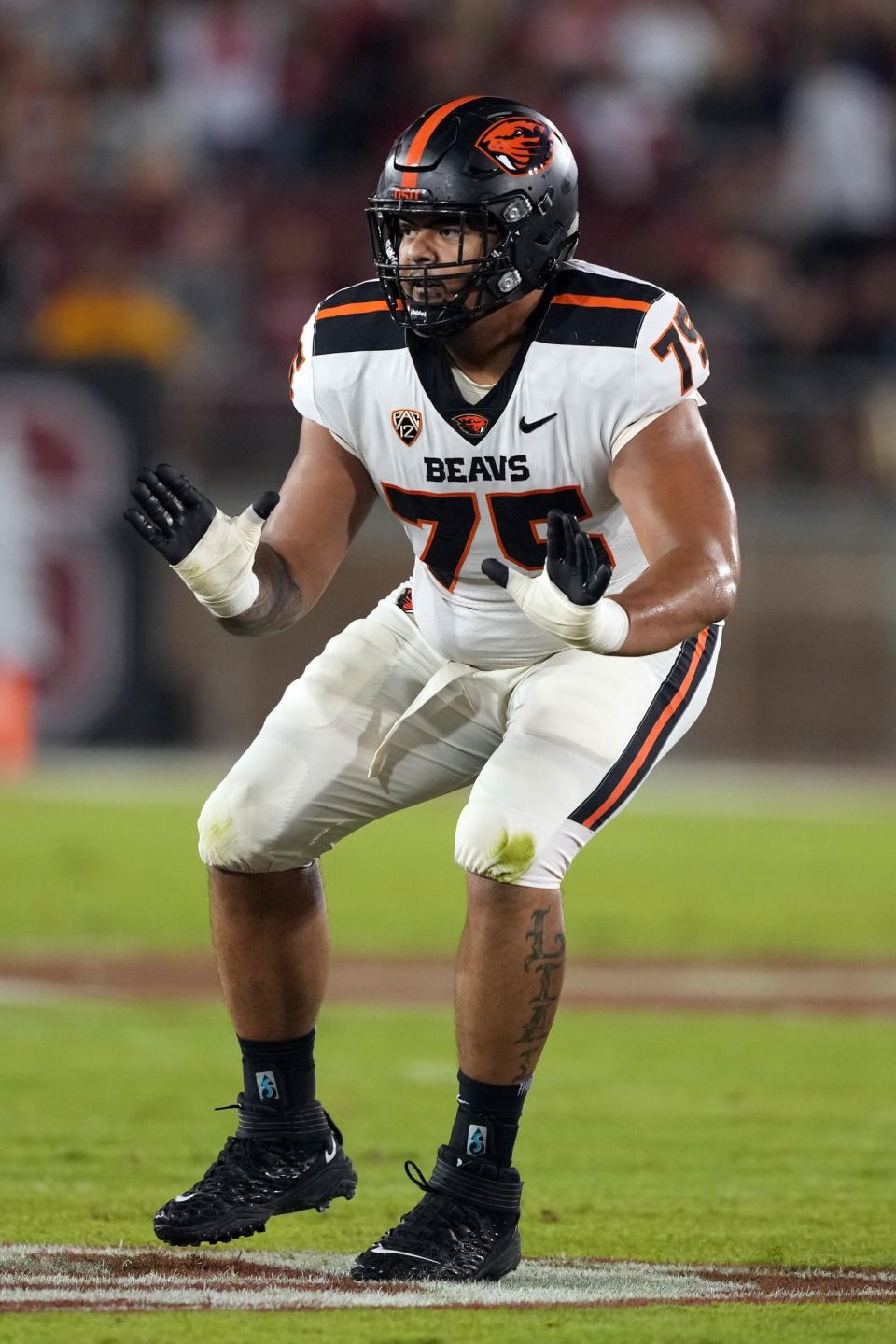 Oct 8, 2022; Stanford, California, USA; Oregon State Beavers offensive lineman Taliese Fuaga (75) blocks during the first quarter against the Stanford Cardinal at Stanford Stadium. Mandatory Credit: Darren Yamashita-USA TODAY Sports