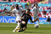 England's Raheem Sterling, left, scores the opening goal past Croatia's Sime Vrsaljko during the Euro 2020 soccer championship group D match between England and Croatia at Wembley stadium in London, Sunday, June 13, 2021. (AP Photo/Frank Augstein, Pool)