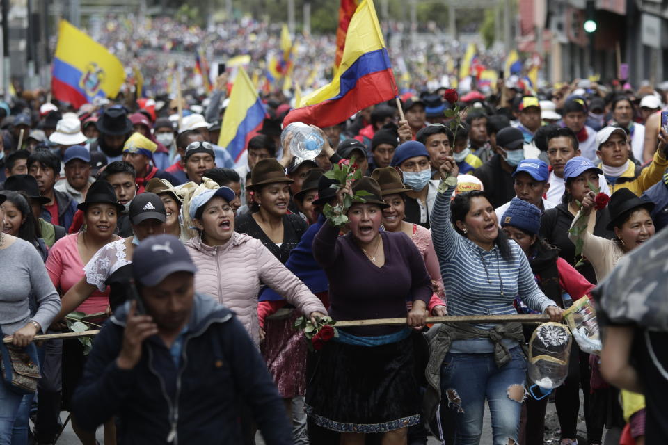 Indigenous anti-government demonstrators chant slogans against President Lenin Moreno and his economic policies during a nationwide strike, in Quito, Ecuador, Wednesday, Oct. 9, 2019. Ecuador's military has warned people who plan to participate in a national strike over fuel price hikes to avoid acts of violence. The military says it will enforce the law during the planned strike Wednesday, following days of unrest that led Moreno to move government operations from Quito to the port of Guayaquil. (AP Photo/Carlos Noriega)