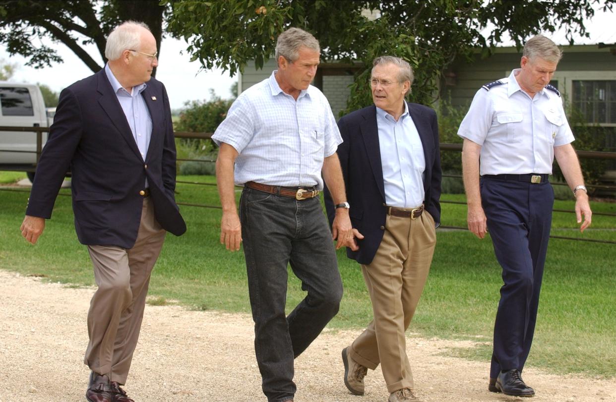 President George W. Bush, second from left, with Vice President Dick Cheney, Secretary of Defense Donald Rumsfeld and Joint Chiefs Chairman Richard Myers, in Crawford, Texas, August 2004