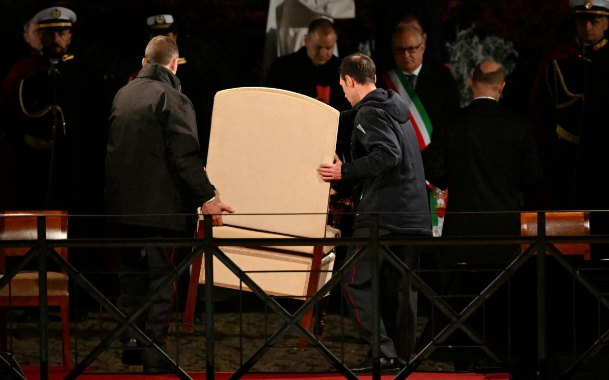 The Pope's armchair is removed at the Colosseum as he is absent