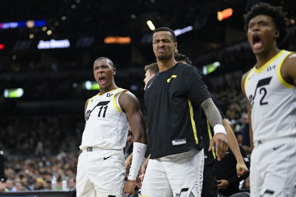 Utah Jazz players celebrate a dunk during the second half of the team’s NBA basketball game against the San Antonio Spurs, Tuesday, Dec. 26, 2023, in San Antonio. | Darren Abate, Associated Press