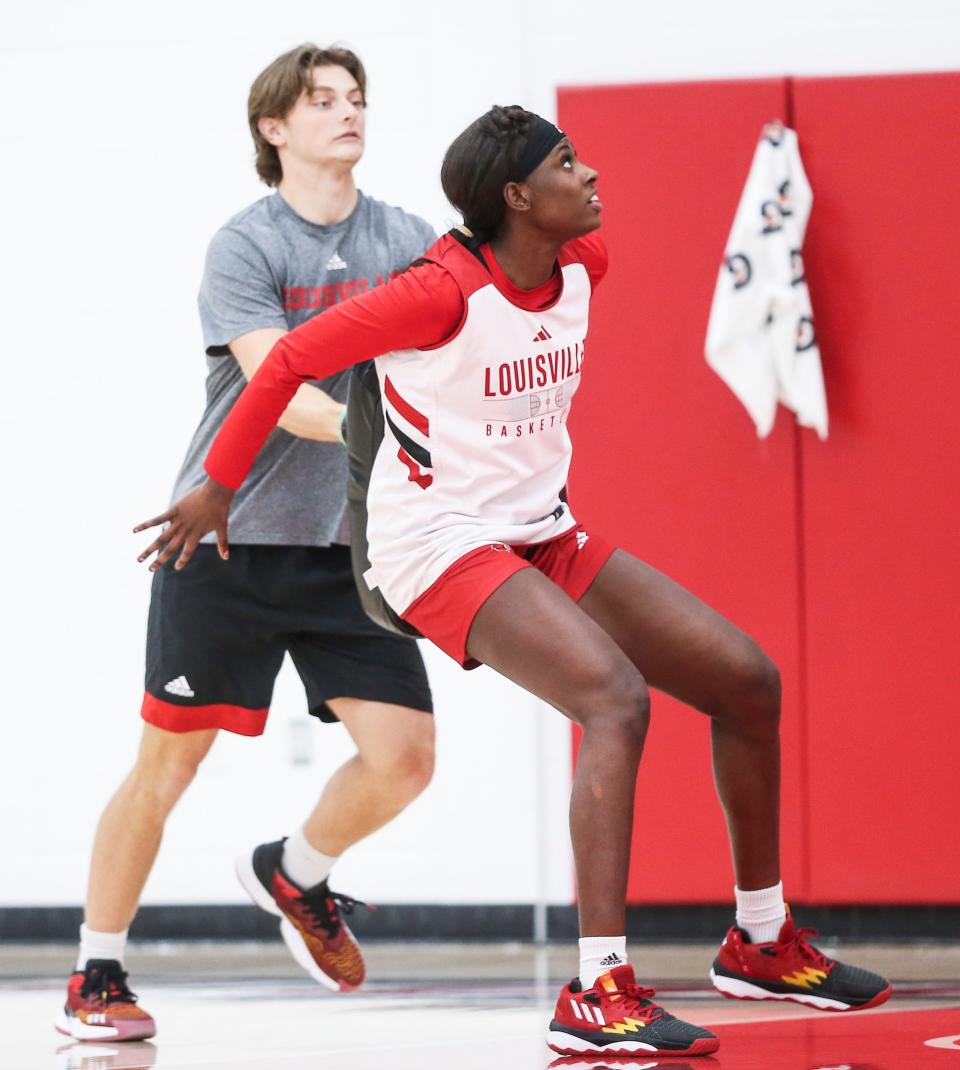 Louisville freshman center Eseosa Imafidon works on blocking out and rebounding during a practice for the upcoming 2023-24 season. Imafidon is 6-5. Oct. 31, 2023.