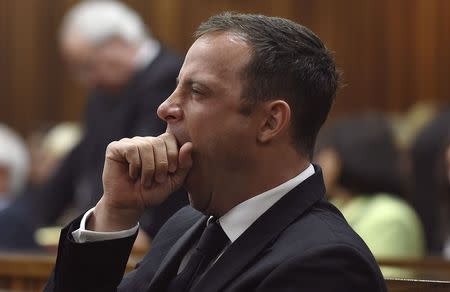 Olympic and Paralympic track star Oscar Pistorius is pictured in the dock before Judge Thokozile Masipa delivers her judgement at the North Gauteng High Court in Pretoria, September 11, 2014. REUTERS/Phill Magakoe/Pool