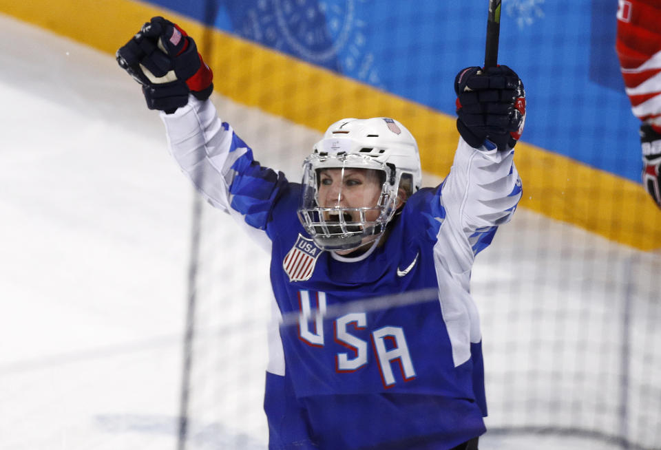 FILE - In this Feb. 22, 2018, file photo, Monique Lamoureux-Morando, of the United States, celebrates after scoring against Canada during the third period of the women's gold medal hockey match at the 2018 Winter Olympics in Gangneung, South Korea, Feb. 22, 2018. Longtime NHL goaltender Ryan Miller and Olympic gold medal-winning women’s hockey stars Jocelyne Lamoureux-Davidson and Monique Lamoureux-Morando headline the 2022 class of the U.S. Hockey Hall of Fame unveiled Thursday, Sept. 8, 2022. (AP Photo/Jae C. Hong, File)