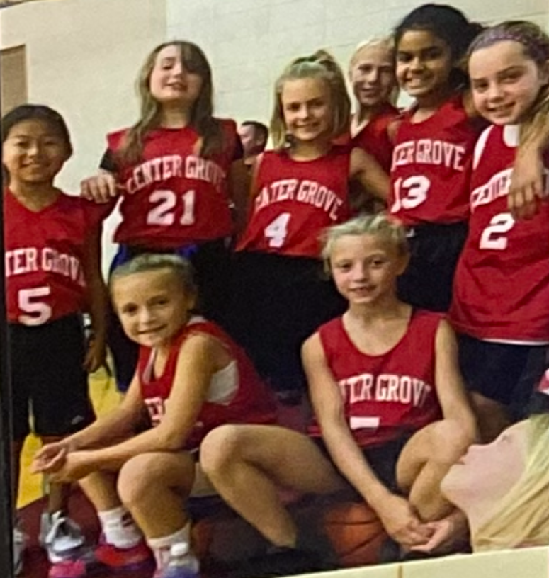 Sophie Sabol (4) poses for a photo with her fifth-grade Center Grove basketball team. Team members include Lauren Foster (21), Faith Wiseman, Aubrie Booker (13), Lilly Bischoff (2) and Gabby Spink (sitting on basketball).
