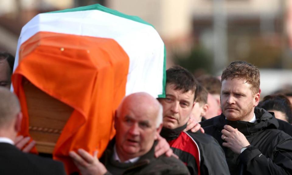 McGuinness’s son Emmett follows his father’s coffin to his home in Derry