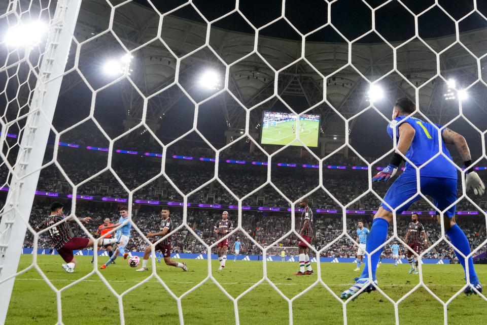 Manchester City's Julian Alvarez, 3rd left, scores his side's fourth goal during the Soccer Club World Cup final match between Manchester City FC and Fluminense FC at King Abdullah Sports City Stadium in Jeddah, Saudi Arabia, Friday, Dec. 22, 2023. (AP Photo/Manu Fernandez)