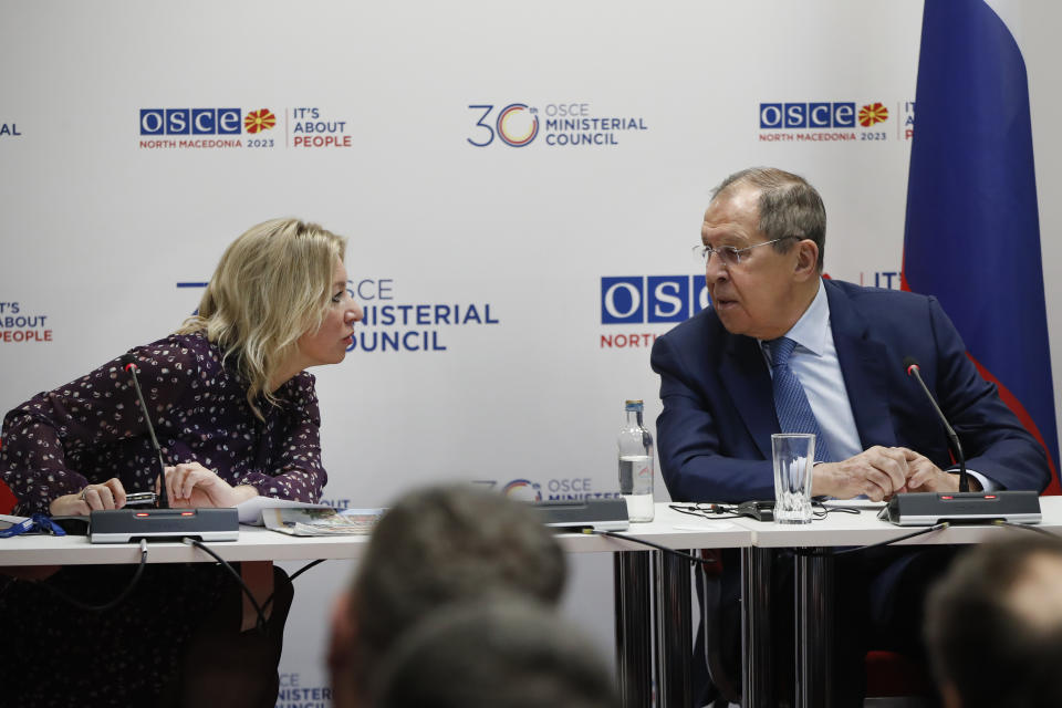 Russia's Foreign Minister Sergey Lavrov, right, shares a word with the spokesperson Maria Zakharova at a news conference, during the OSCE (Organization for Security and Co-operation in Europe) Ministerial Council meeting, in Skopje, North Macedonia, on Friday, Dec. 1, 2023. (AP Photo/Boris Grdanoski)