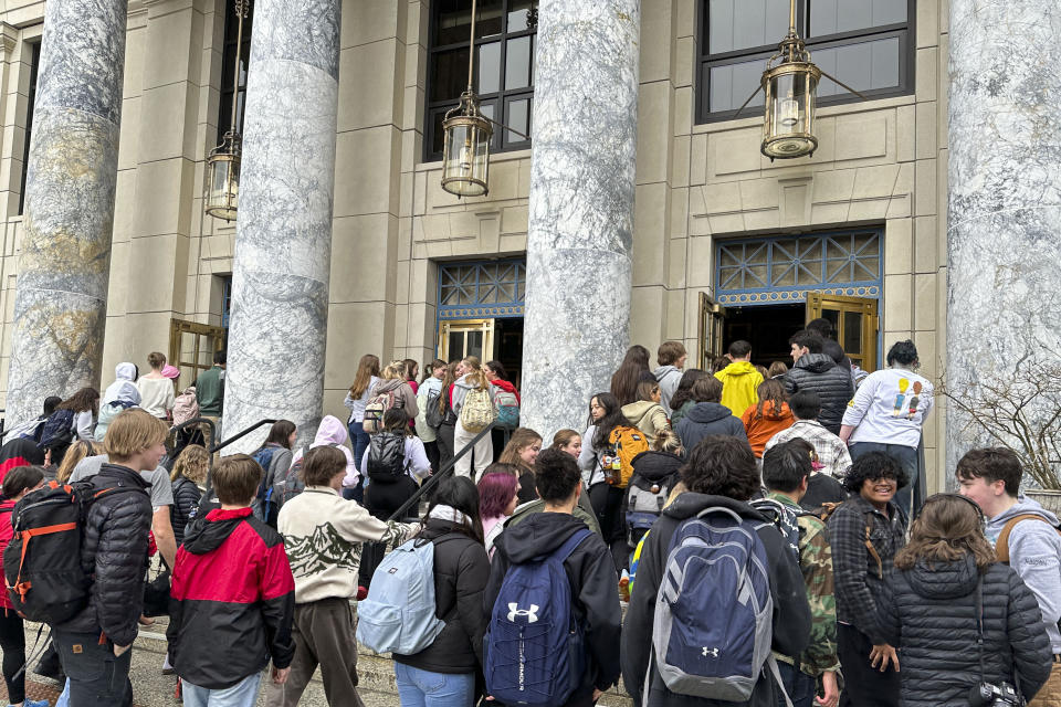 Students who walked out of Juneau-Douglas High School: Yadaa.at Kalé to protest Gov. Mike Dunleavy's veto of an education package enter the state Capitol, Thursday, April 4, 2024, in Juneau, Alaska. The walkout was part of a statewide protest organized by the executive board of the Alaska Association of Student Governments, according to Felix Myers, who is from Sitka and was one of the organizers. (AP Photo/Becky Bohrer)