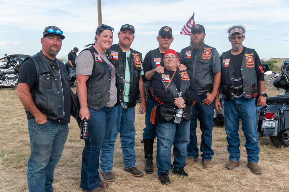 Members of the group Brother's Keepers stand together after completing their ride at Saturday at the Homeless Heroes Bike Run in Amarillo.