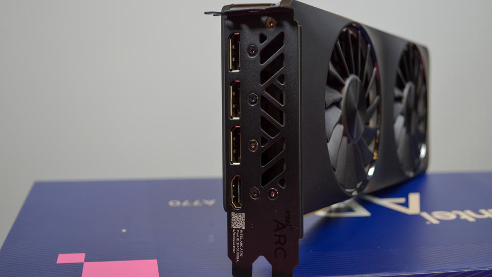 An Intel Arc A770 LE graphics card on a table with a pink desk mat