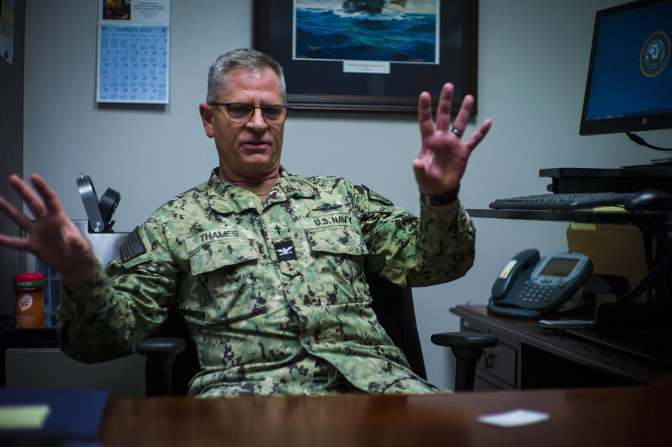 Capt. David Thames, Surface Fleet Atlantic (SURFLANT) Force chaplain of the U.S. Navy, speaks about the Navy's plan to assign additional chaplains permanently to Navy support surface ships at his office at Norfolk Naval Station in Norfolk, Va. on Monday, March 13, 2023. The very real prospect of killing or being killed in combat provokes “God-sized questions,” in Thames’ words, who joined the Navy after 9/11 and served three tours in Iraq and Afghanistan. (AP Photo/John C. Clark)