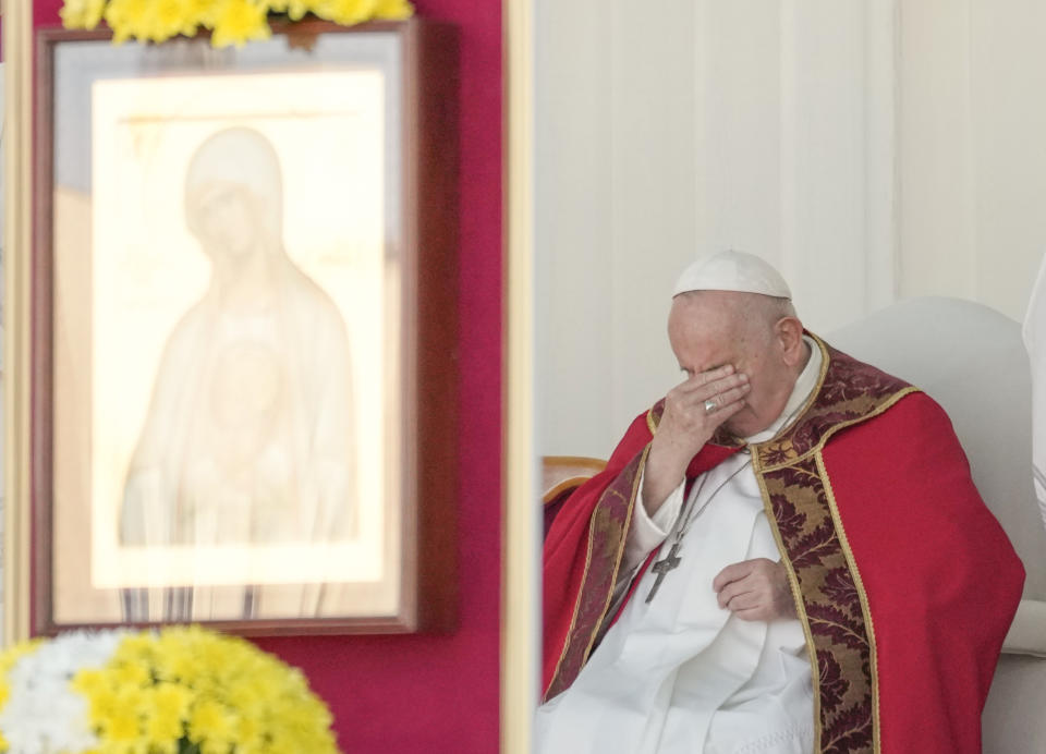 Pope Francis rubs his eyes as he presides over a Mass at the Expo Grounds in Nur-Sultan, Kazakhstan, Wednesday, Sep. 14, 2022. Pope Francis is on the second day of his three-day trip to Kazakhstan.(AP Photo/Andrew Medichini)