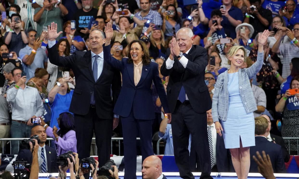 <span>Doug Emhoff, Kamala Harris, Tim Walz and Gwen Walz at a rally in Philadelphia on 6 August.</span><span>Photograph: Kevin Lamarque/Reuters</span>