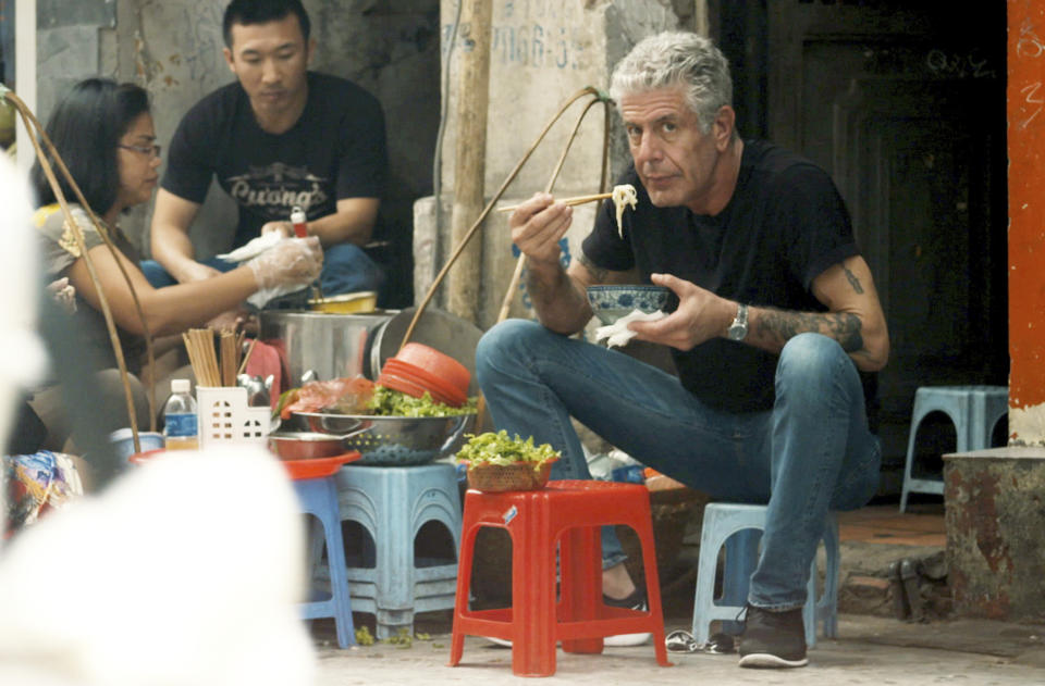 This image released by Focus Features shows Anthony Bourdain in Morgan Neville's documentary "Roadrunner." The film will have its world premiere at the Tribeca Film Festival on Friday, June 11, 2021. (Focus Features via AP)