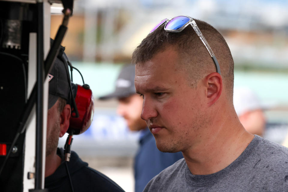 HOMESTEAD, FLORIDA - OCTOBER 21: Ryan Preece, driver of the #17 Compustar/RaceChoice Ford, meets with his crew on the grid during practice for the NASCAR Camping World Truck Series Baptist Health 200 at Homestead-Miami Speedway on October 21, 2022 in Homestead, Florida. (Photo by Jared East/Getty Images)