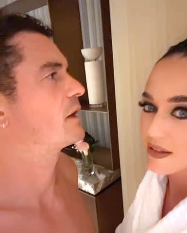 <p>Katy Perry /Instagram</p> Orlando Bloom looks on as Katy Perry removes her bangs