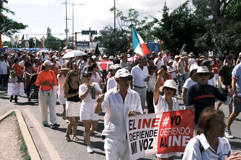 People take part in a protest against the electoral reform proposed by Mexican President Andres Manuel Lopez Obrador and in support of INE in Cancun Quintana Roo