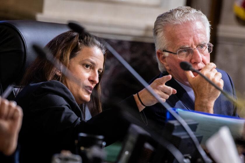 Los Angeles, CA - May 16: Los Angeles City Councilwoman Katy Yaroslavsky (District 5), left, speaks with Councilman Paul Krekorian (District 2), during a meeting where the Council deadlocked on her proposal, 7-7, to ask City Planning Director Vince Bertoni to consider rescinding a general plan amendment initiation for the Bulgari Resort Los Angeles, a planned 58-room hotel that would rise in Benedict Canyon, at City Hall in downtown Los Angeles, CA, Tuesday, May 16, 2023. Developer Gary Safady's proposal will continue in the process, with an environmental impact report being completed. (Jay L. Clendenin / Los Angeles Times)