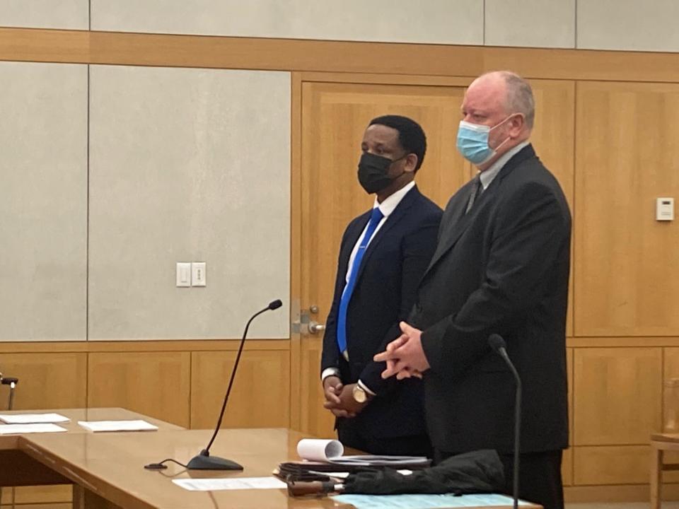 Antoine Henrys left with his lawyer Andrew Quinn before pleading guilty to second-degree manslaughter on April 12, 2022, in a September 2020 crash that killed a motorcyclist on the Hutchinson River Parkway in Mount Vernon. Henrys was a Mount Vernon police officer at the time of the crash and resigned the day before his guilty plea.