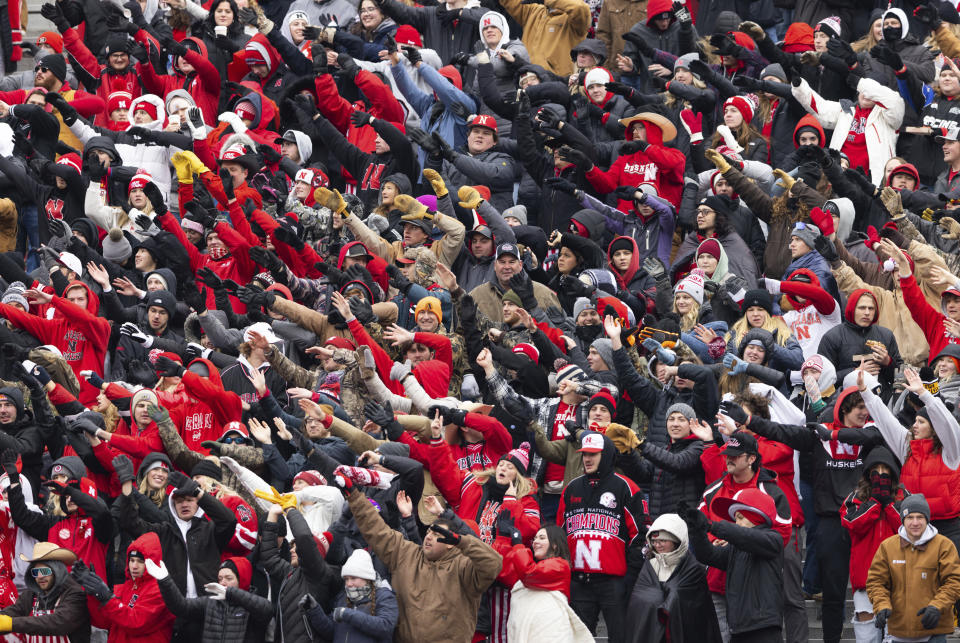 FILE - Nebraska fans cheer for a touchdown against Iowa during the first half of an NCAA college football game, Nov. 24, 2023, in Lincoln, Neb. Nebraska and Ohio State are opening one or more of their preseason practices and charging admission. (AP Photo/Rebecca S. Gratz, File)