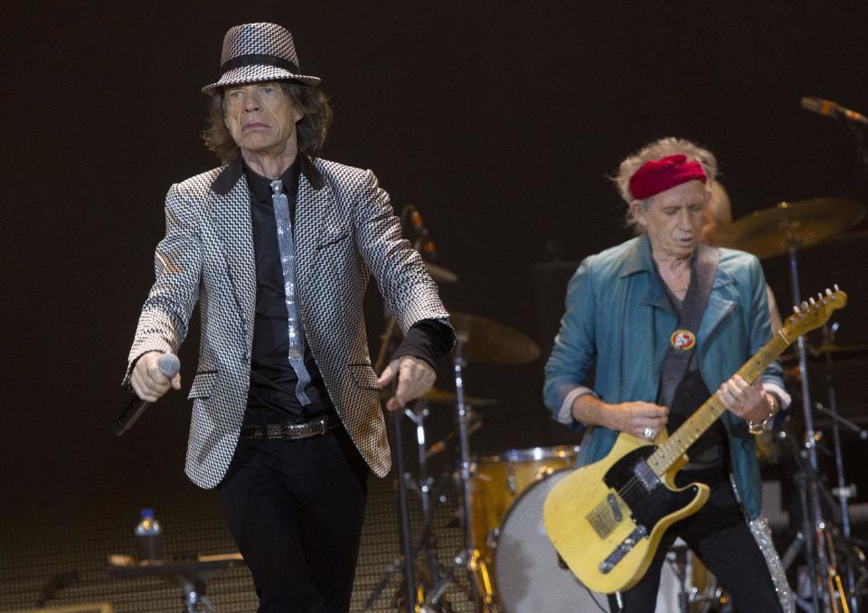 Mick Jagger, left and Keith Richards, of The Rolling Stones perform at the O2 arena in east London, Sunday, Nov. 25, 2012. The band are playing four gigs to celebrate their 50th anniversary, including two shows at London’s O2 and two more in New York. (Photo by Joel Ryan/Invision/AP)