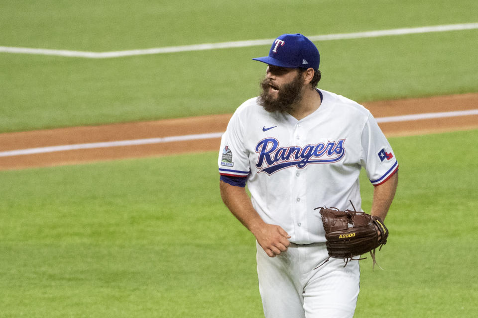 Texas Rangers starting pitcher Lance Lynn exults after getting Arizona Diamondbacks' Eduardo Escobar to line out to left during the third inning of a baseball game Wednesday, July 29, 2020, in Arlington, Texas. (AP Photo/Jeffrey McWhorter)