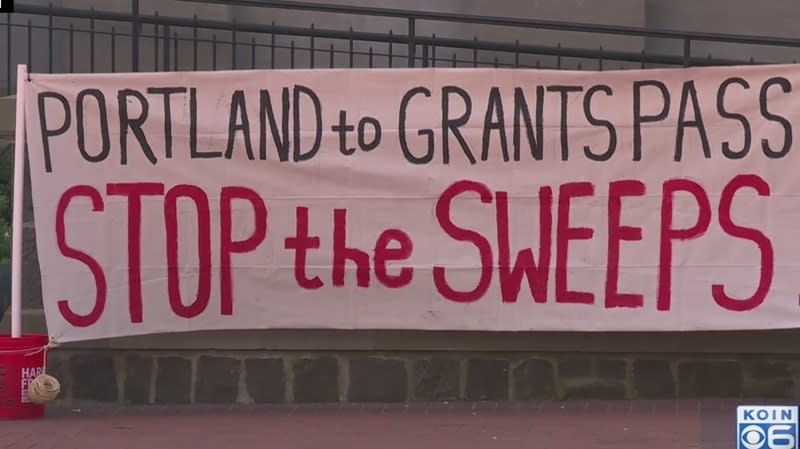 Stop The Sweeps PDX held this sign in Pioneer Courthouse Square in downtown Portland, April 22, 2024 (KOIN)