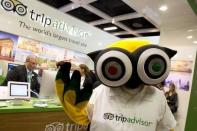 A mascot of tripadvisor is seen at its stand at the International Tourism Trade Fair (ITB) in Berlin March 4, 2015. The fair has over 10,000 exhibitors from around 190 countries. REUTERS/Axel Schmidt (GERMANY - Tags: BUSINESS TRAVEL) - RTR4S28V