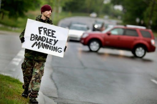 Justin Sorci of Jacksonville, Florida, shows his support for accused WikiLeaks whistle-blower US Army PFC Bradley Manning while standing vigil outside the front gates of Fort George Meade in Maryland. A US military judge ruled Thursday that WikiLeaks suspect Manning can be tried for "aiding the enemy" over allegedly leaking documents to the site -- a charge that carries a potential life sentence