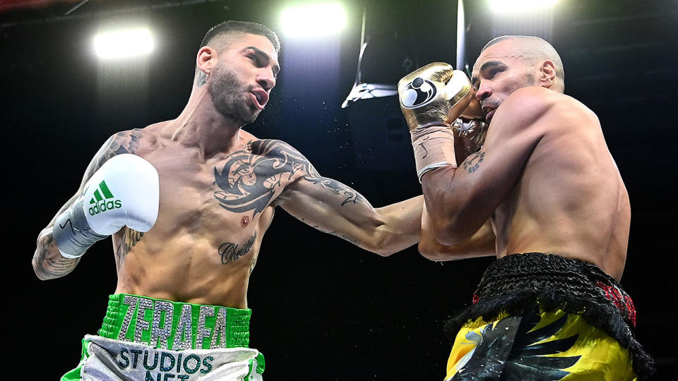 Pictured here, Anthony Mundine braces for a punch from Michael Zerafa.