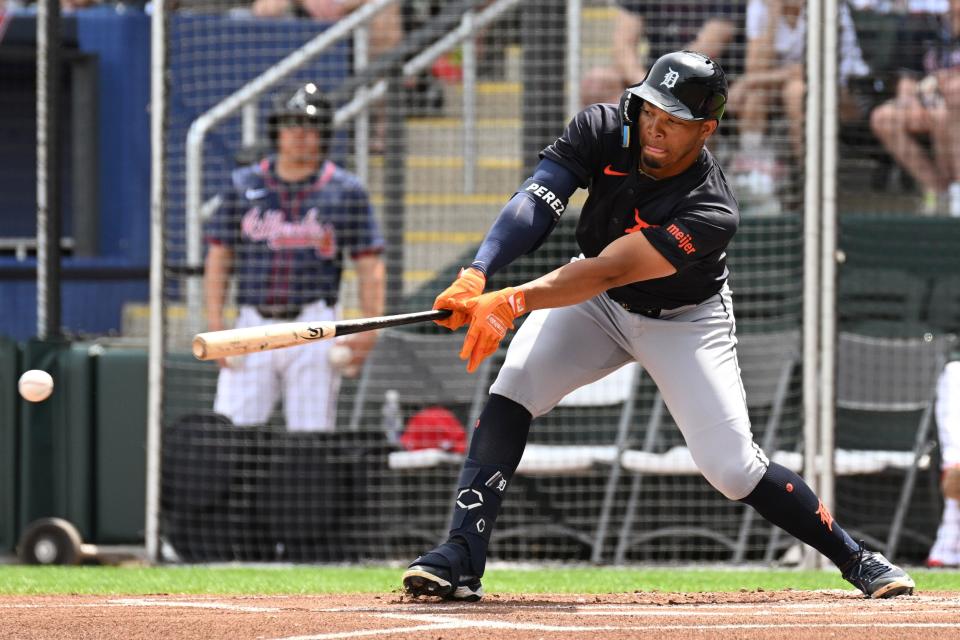 Detroit Tigers center fielder Wenceel Perez reaches for a pitch in the first inning of the spring training game against the Atlanta Braves at CoolToday Park on March 5, 2024, in North Port, Florida.