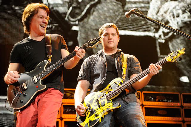 <p>Kevin Mazur/WireImage</p> Eddie Van Halen and Wolf Van Halen on stage together in 2012