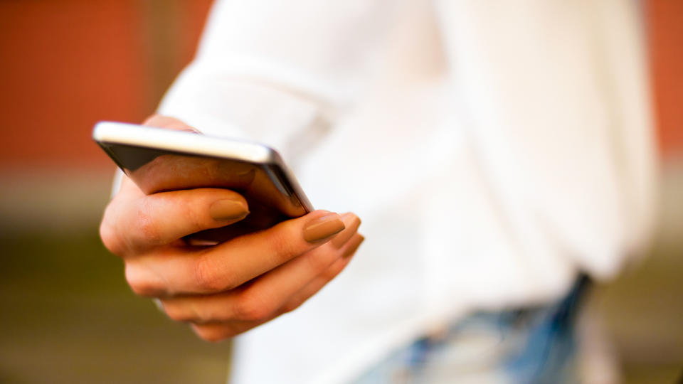 closeup of woman's hand holding phone