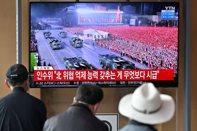 People in Seoul watch an April 25 news broadcast of a military parade in Pyongyang commemorating the 90th anniversary of the founding of the Korean People's Revolutionary Army. Some experts think the parade acted as a superspreader event for COVID-19 in North Korea. (Photo: JUNG YEON-JE via Getty Images)