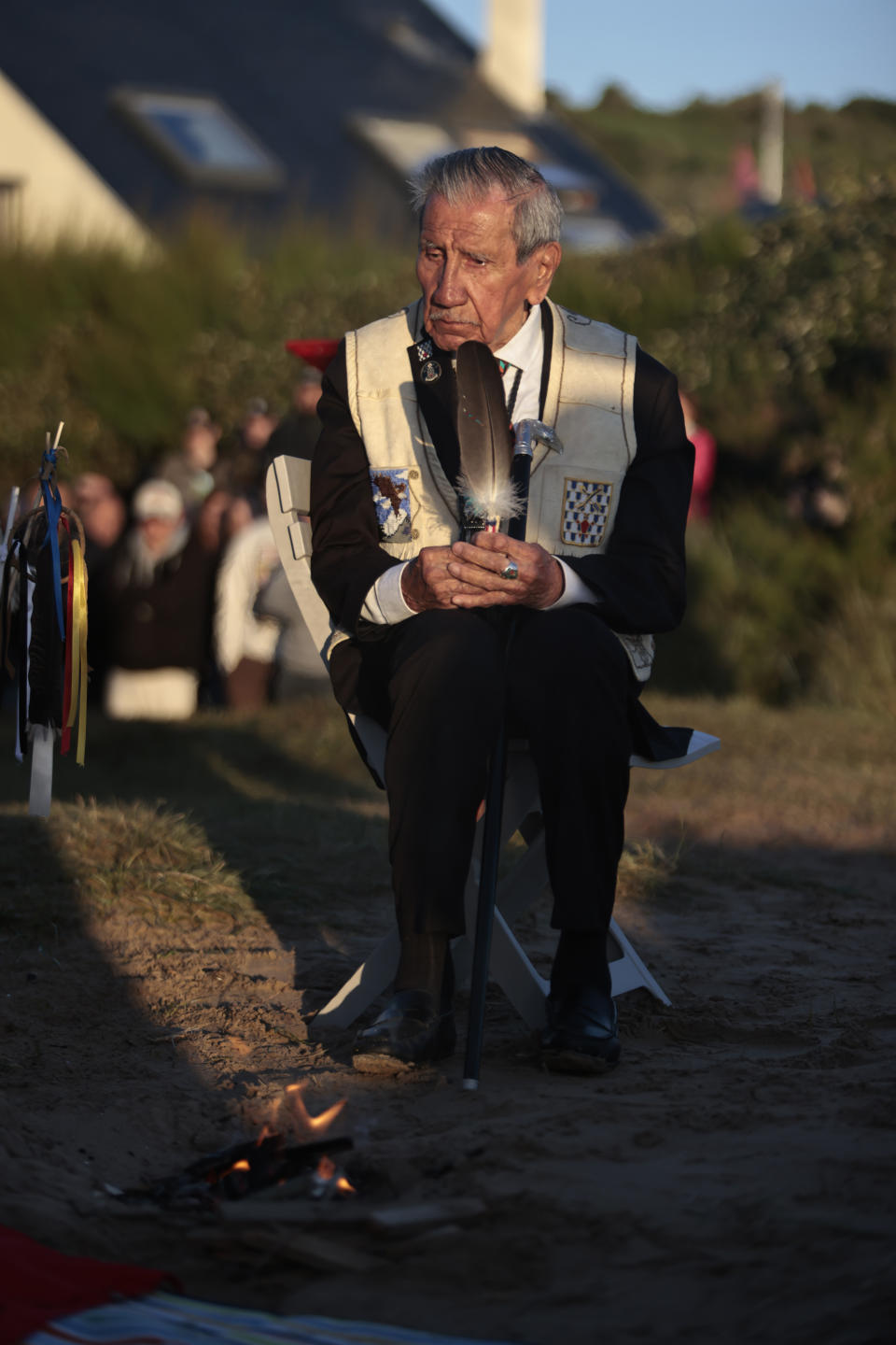 WWII veteran Charles Shay, 97 pays tribute to soldiers during a D-Day commemoration ceremony of the 78th anniversary for those who helped end World War II, in Saint-Laurent-sur-Mer, Normandy, France, Monday, June 6, 2022. (AP Photo/ Jeremias Gonzalez)