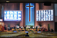 Members of the choir wearing face masks to help protect against the spread of the coronavirus sing a hymn during a service at the Yoido Full Gospel Church in Seoul, South Korea, Sunday, Sept. 20, 2020. South Korea's new coronavirus tally has fallen below 100 for the first time in more than a month. (AP Photo/Ahn Young-joon)