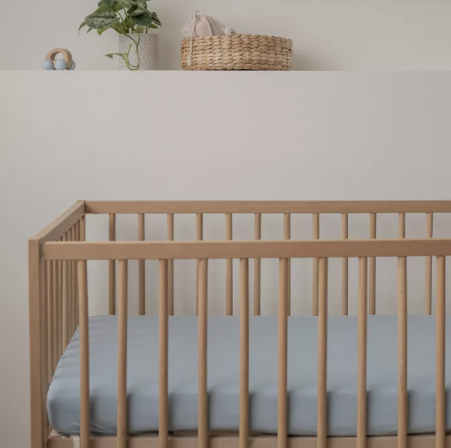 A photo of a baby's cot.