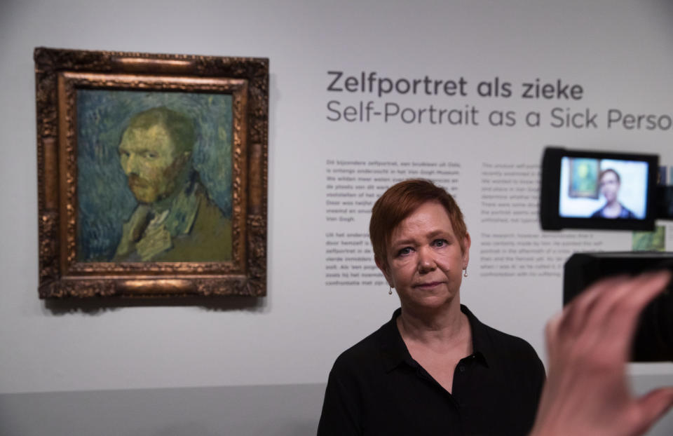 Norway's National Museum curator Mai Britt Guleng talk about the previously contested painting by Dutch master Vincent van Gogh, a 1889 self-portrait, left, of which the authenticity was confirmed during a press conference in Amsterdam, Netherlands, Monday, Jan. 20, 2020. The painting, which belongs to the National Museum in Norway, was painted at the Saint-Paul de Mausole psychiatric institution in Saint-Remy de Provence, France. (AP Photo/Peter Dejong)